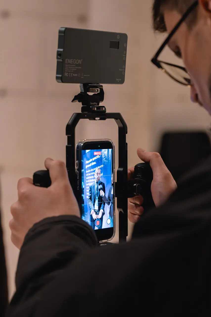 Someone filming the keynote on a smartphone
